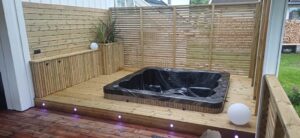 Outdoor hot tub integrated into decking