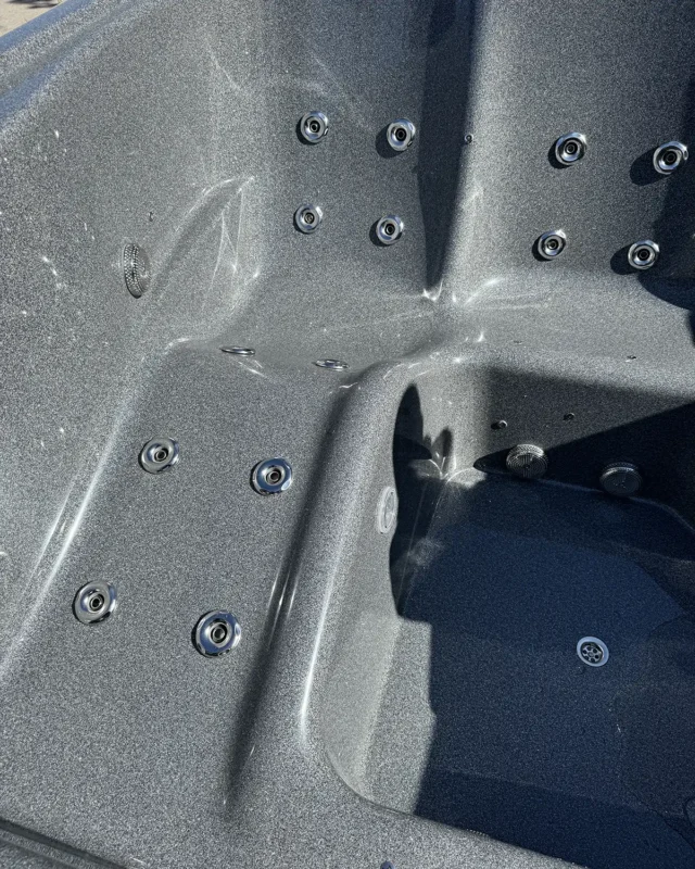 Close-up of hydromassage hot tub seating with powerful jets and premium 3D Granite surface.