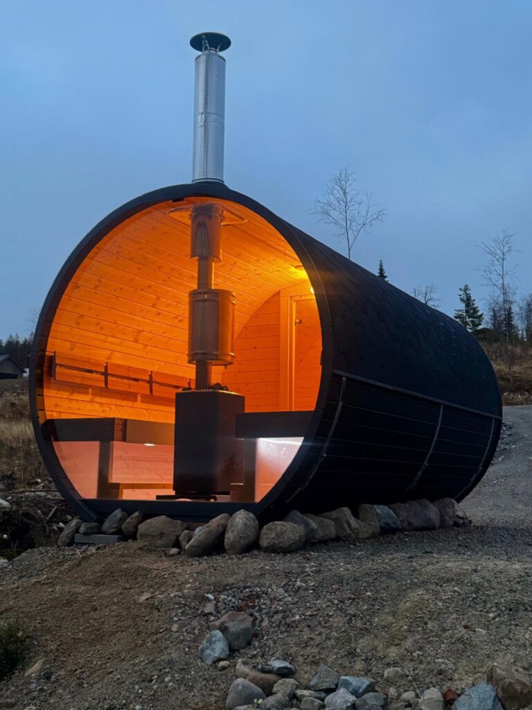 Modern barrel-shaped sauna in nature